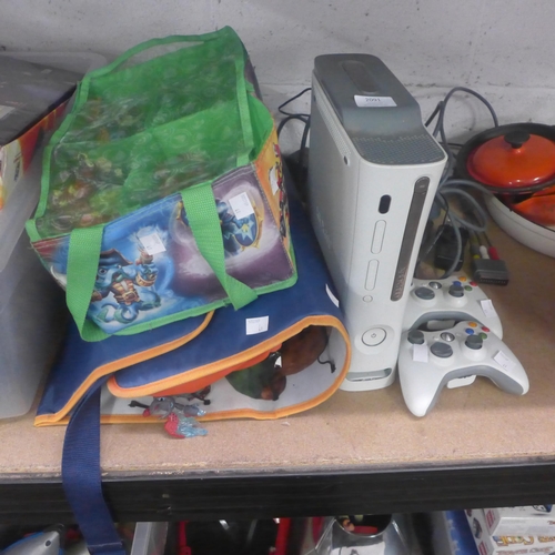 2091 - An Xbox 360 with an assortment of Skylanders, Disney Infinity figures and two controllers