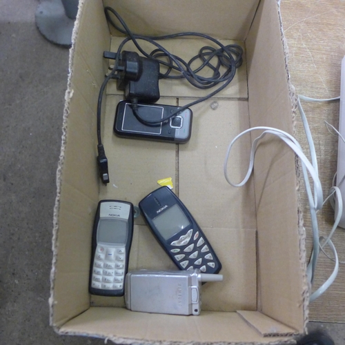 2105 - Two Nokia phones, a Samsung flip phone and other phones