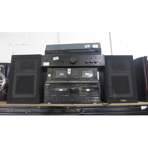 2135 - A quantity of stereo equipment including a Fisher MT-223 studio standard semi-automatic turntable re... 