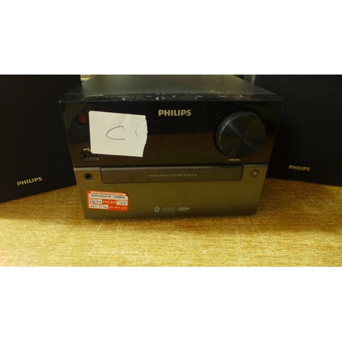 2147 - A Philips micro music system (model BT2310/05), a pair of Philips speakers (model DT2310) and a case... 