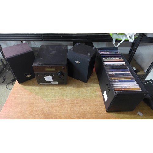 2148 - A Bush compact disc audio player (model RX-ED50), 2 Bush speakers and a collection of CDs