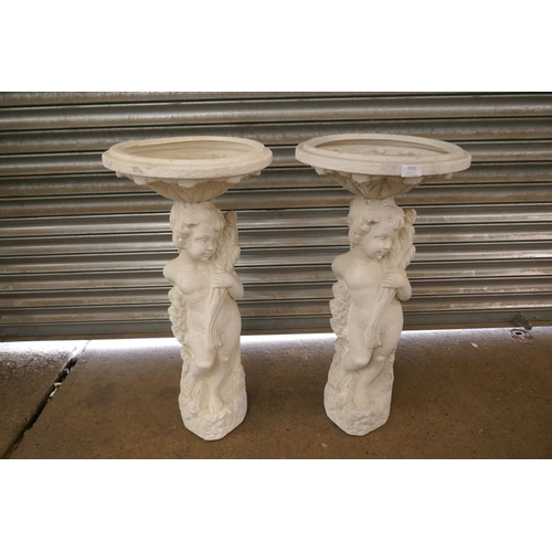 2231 - A pair of matching plastic bird baths