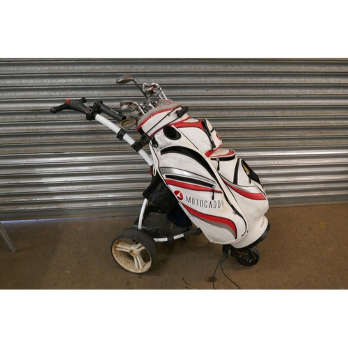 2308 - A Motocaddy digital S1 golf trolley and bag with a set of clubs including- Wilson staff DI9 P,S,4,5,... 