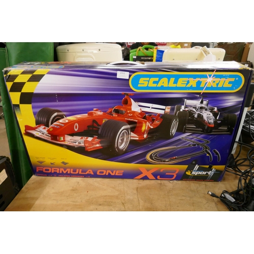 A Scalextric formula one X3 Ferrari McLaren set in box