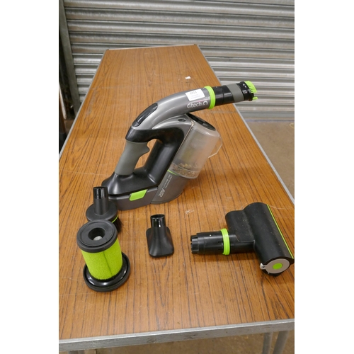 2313 - A G-tech 22v cordless hand held vacuum cleaner with attachments and replacement filter