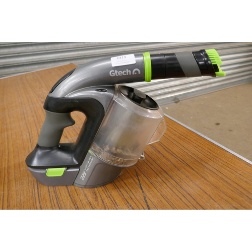 2313 - A G-tech 22v cordless hand held vacuum cleaner with attachments and replacement filter