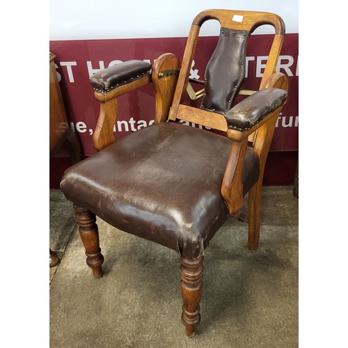 82 - An early 20th Century beech and brown leather adjustable dentist's chair