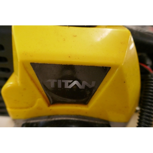 2215 - A Titan petrol gardenig multitool with attachments including- strimmer, bush cutter blade, hedge cut... 