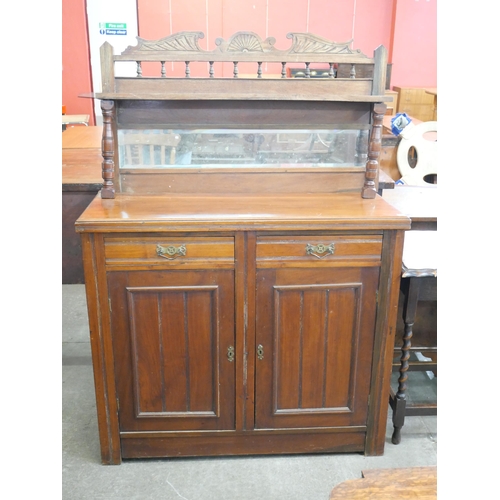 102 - A Victorian walnut mirrorback side cabinet