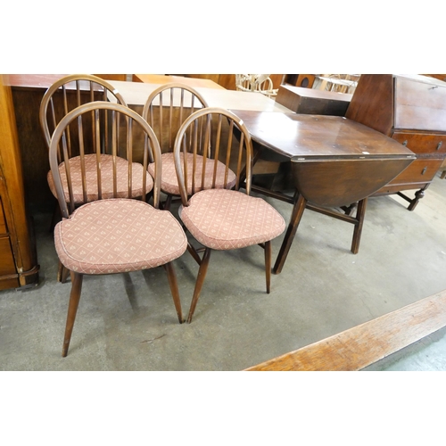 109 - An Ercol Golden Dawn elm and beech Windsor drop leaf table and four chairs