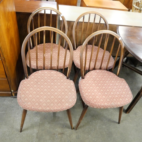 109 - An Ercol Golden Dawn elm and beech Windsor drop leaf table and four chairs