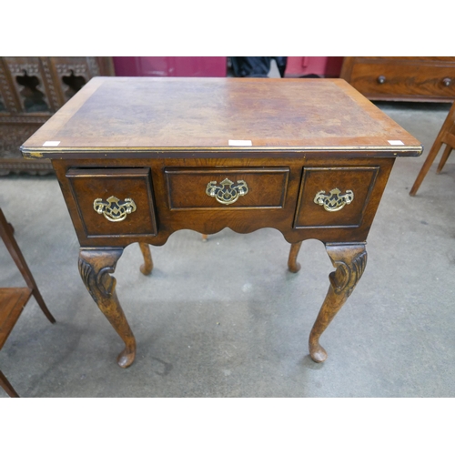 113 - A Queen Anne style burr walnut lowboy