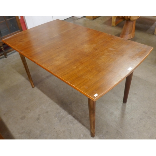 12 - A teak dining table