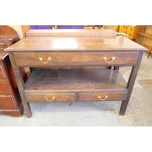 120 - A George III style oak three drawer two tier serving table