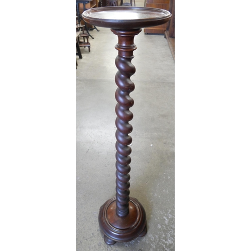 121 - A mahogany barleytwist torchere