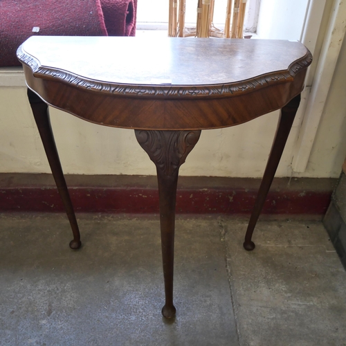 127 - A burr walnut demi-lune hall table