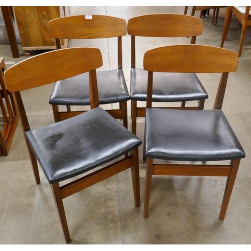 13 - A set of four teak dining chairs