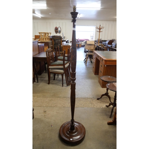 139 - A Chinese carved hardwood standard lamp