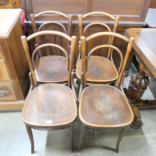 144 - A set of four early 20th Century beech bentwood chairs