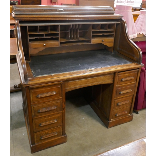 151 - An early 20th Century oak tambour roll top desk