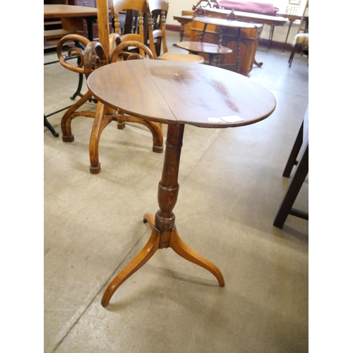 161 - A Victorian oak circular tripod wine table