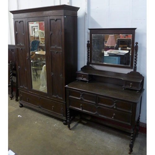 198 - An early 20th Century oak geometric moulded two piece bedroom suite