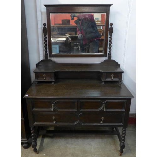 198 - An early 20th Century oak geometric moulded two piece bedroom suite