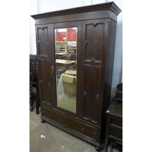 198 - An early 20th Century oak geometric moulded two piece bedroom suite