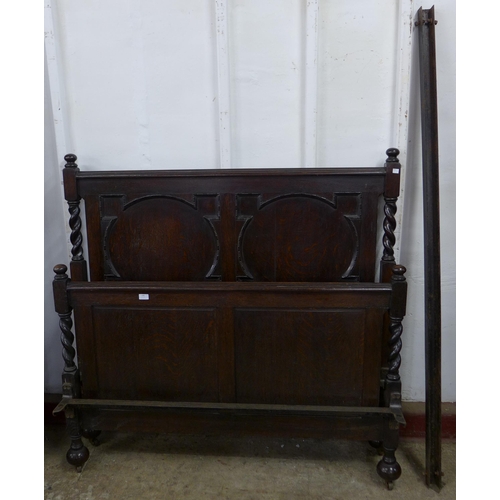 199 - An early 20th Century oak geometric moulded double bed