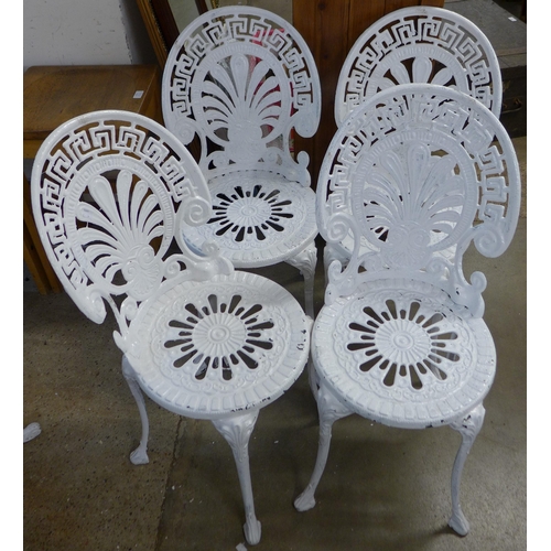 200 - A painted cast alloy garden table and four chairs