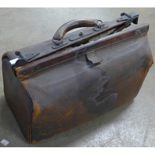 208 - Two vintage steamer trunks and a suitcase