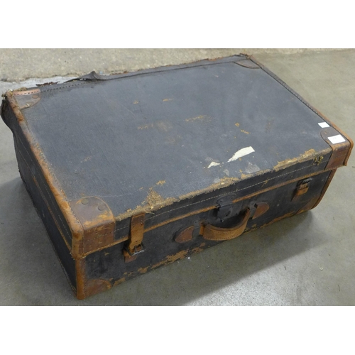 208 - Two vintage steamer trunks and a suitcase