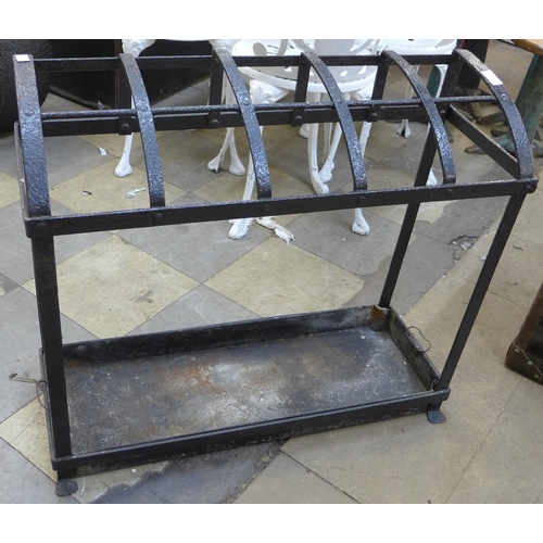 215 - A Victorian black wrought iron strapwork stick stand