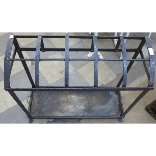 215 - A Victorian black wrought iron strapwork stick stand