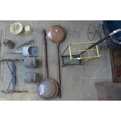 217 - A brass stick stand, warming pans, weighing scales, etc.