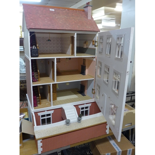 223 - A large vintage dolls house, with furnishings and figures