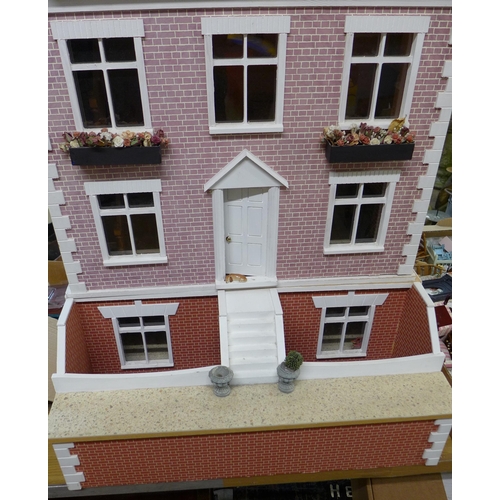 223 - A large vintage dolls house, with furnishings and figures