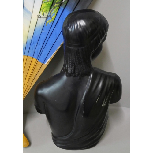 239C - A black porcelain bust of a lady and a large oriental fan