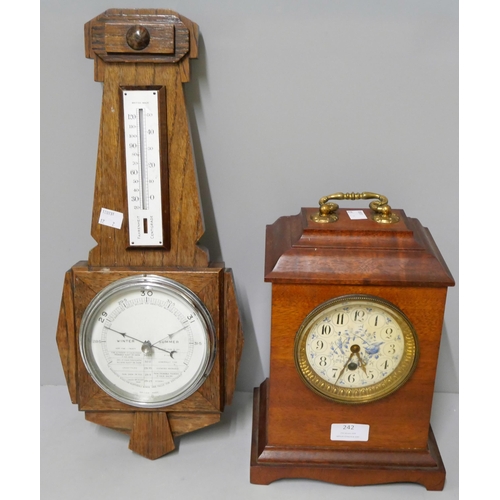 242 - An early 20th Century mantel clock and an Art Deco oak aneroid barometer