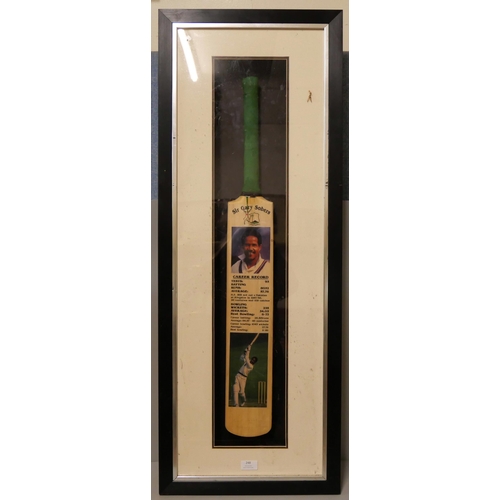 248 - A signed commemorative Sir Gary Sobers cricket bat, framed