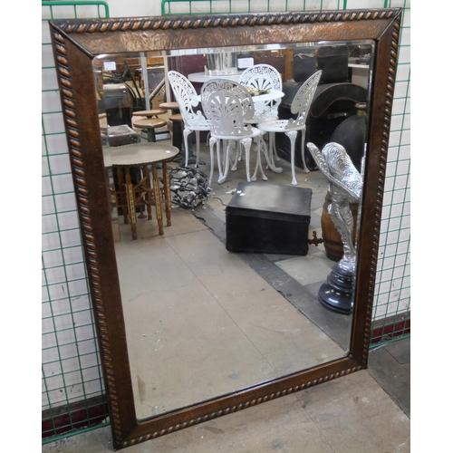 258 - A large Arts and Crafts copper framed mirror