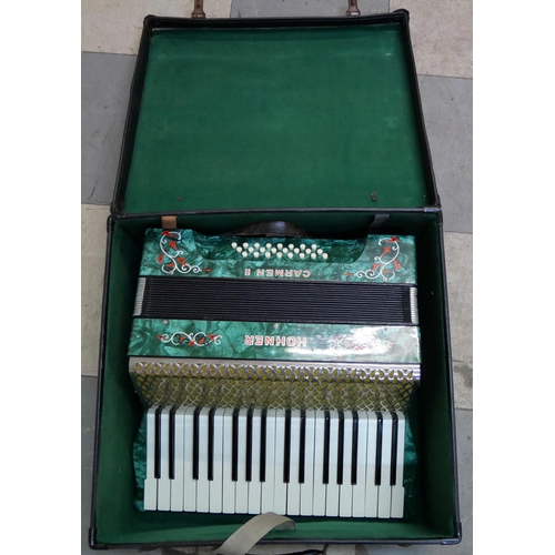 265 - A cased Hohner piano accordian