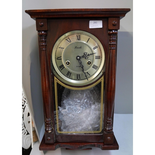 281 - A Lincoln 31-day wall clock and a Singer sewing machine