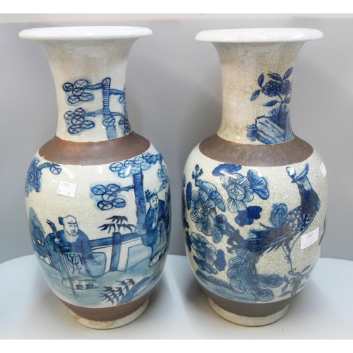 282 - A pair of oriental blue and white porcelain vases