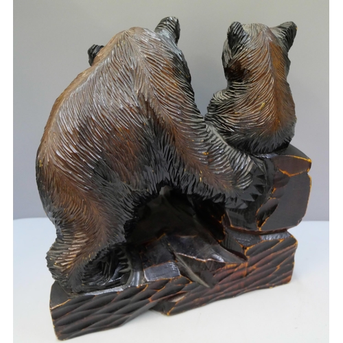 286 - A Japanese carved softwood figure of bears