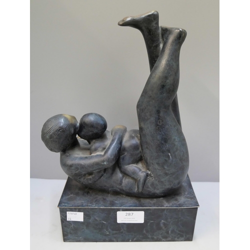 287 - An abstract bronze figure of mother and child