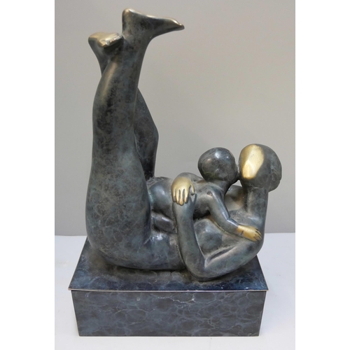 287 - An abstract bronze figure of mother and child