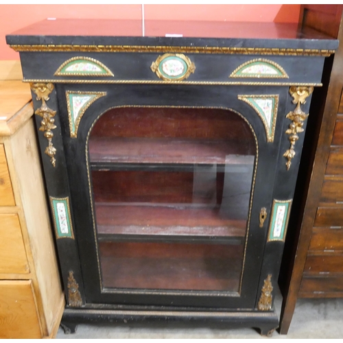 74 - A 19th Century French ebonised and ormolu pier cabinet, with Sevres style porcelain mounts