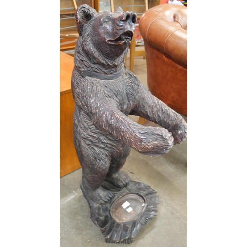 80 - A Black Forest style faux carved wood figure of a bear