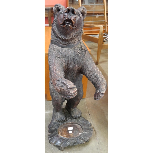 80 - A Black Forest style faux carved wood figure of a bear